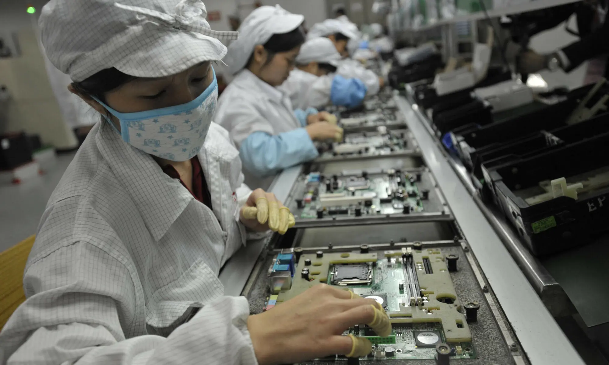 This file photo shows Chinese workers in the Foxconn factory in Shenzhen, in southern China&rsquo;s Guangdong province. &mdash; AFP/File