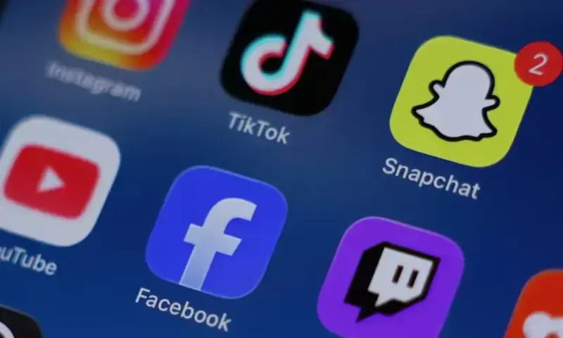 Instagram, TikTok, Snapchat, YouTube, Facebook, Twitch and Reddit applications are displayed on a mobile phone in this picture illustration taken on December 9, 2025. &mdash; Reuters/File