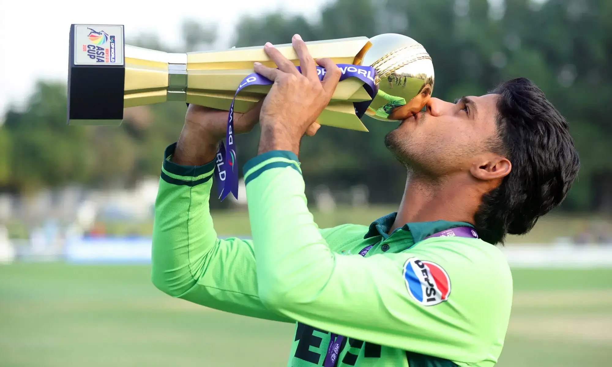 Pakistan U-19 captain Farhan Yousaf kisses the U-19 Asia Cup trophy after beating India in the final at the ICC Academy Ground in Dubai on December 21, 2025.&mdash;Courtesy Asian Cricket Council