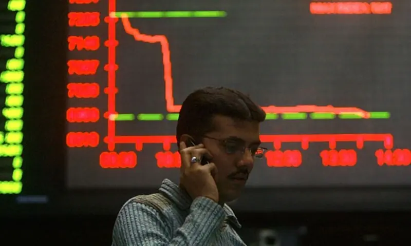 A stockbroker talks on his mobile during a trading session inside the trading hall of the Karachi Stock Exchange &mdash; Reuters/File