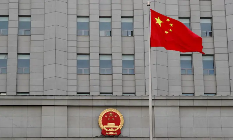 A Chinese national flag waves outside Beijing People&rsquo;s Court. &mdash; Reuters