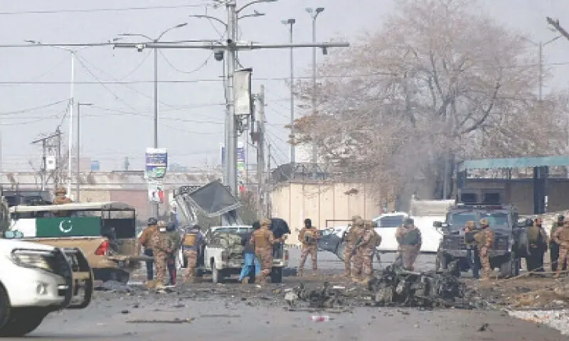 SOLDIERS gather at the site of a terrorist attack in Quetta.&mdash;Reuters/File