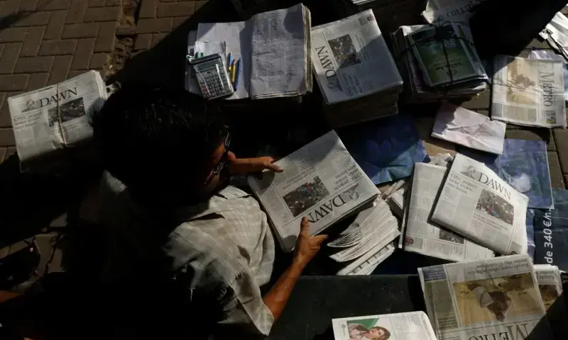 A hawker sorts out newspapers as he sells them along a street in Karachi, Pakistan on October 7, 2018. — Reuters/File A hawker sorts out newspapers as he sells them along a street in Karachi, Pakistan on October 7, 2018. — Reuters/File