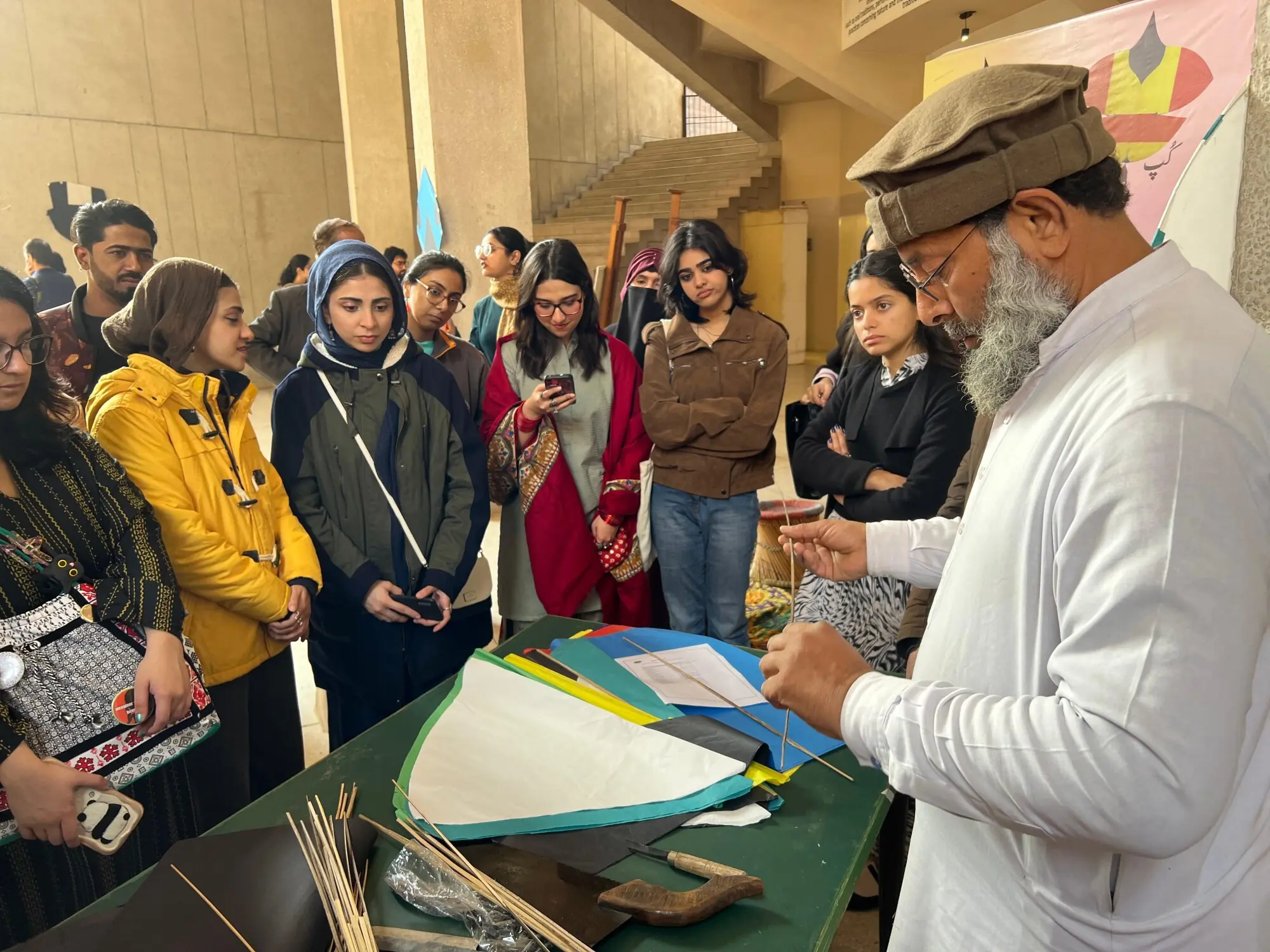 Young people attending a kite making workshop in Lahore. Photo: Murtaza Ali/White Star