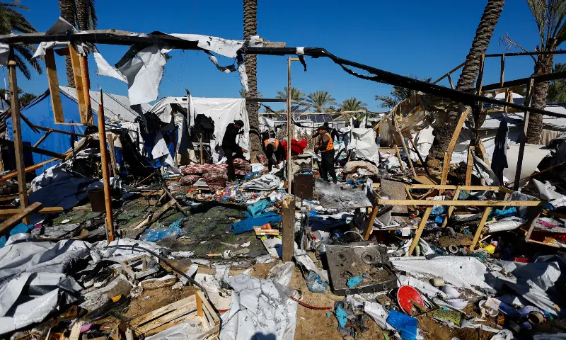 Civil Defence members and Palestinians inspect the site of an Israeli strike on a tent camp sheltering displaced people, in Khan Younis, in the southern Gaza Strip, Feb 4, 2026. &mdash; Reuters