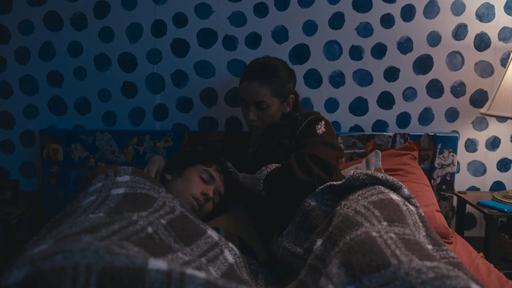 Masrat (Diana Aras) comforts her son Rizwan (Alex Cheeks). Photo: Arfat Sheikh/Daffodil Studios