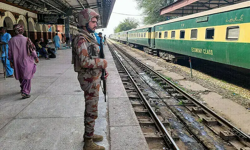 A paramilitary soldier stands guard at a railway station in the Sibi district of Balochistan on March 12, 2024. — AFP/File A paramilitary soldier stands guard at a railway station in the Sibi district of Balochistan on March 12, 2024. — AFP/File