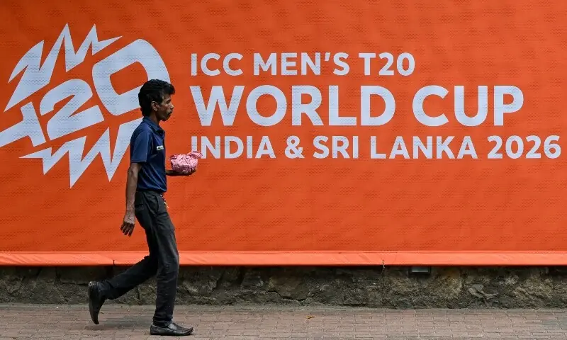 A man walks past a billboard advertising the 2026 ICC Men&rsquo;s T20 Cricket World Cup, at the Sinhalese Sports Club cricket stadium in Colombo, Sri Lanka on February 5. &mdash; AFP