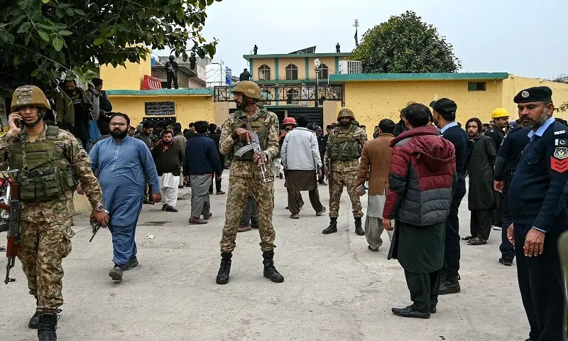 Security personnel stand guard outside an imambargah following an explosion, in Islamabad on February 6, 2026. &mdash;AFP