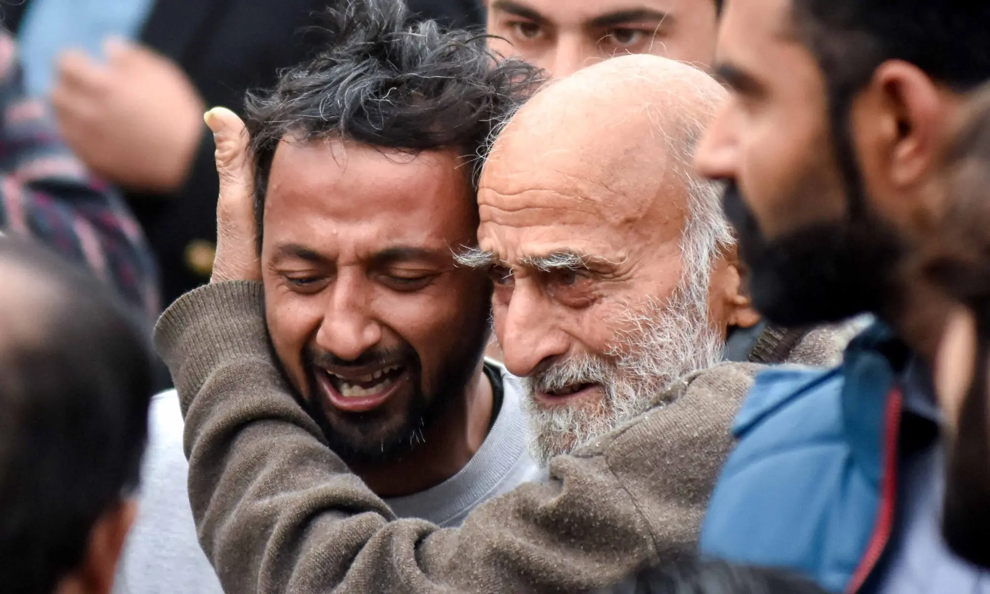 A man reacts while being comforted after a deadly explosion at an imambargah in Islamabad, Pakistan, February 6, 2026. &mdash; Reuters