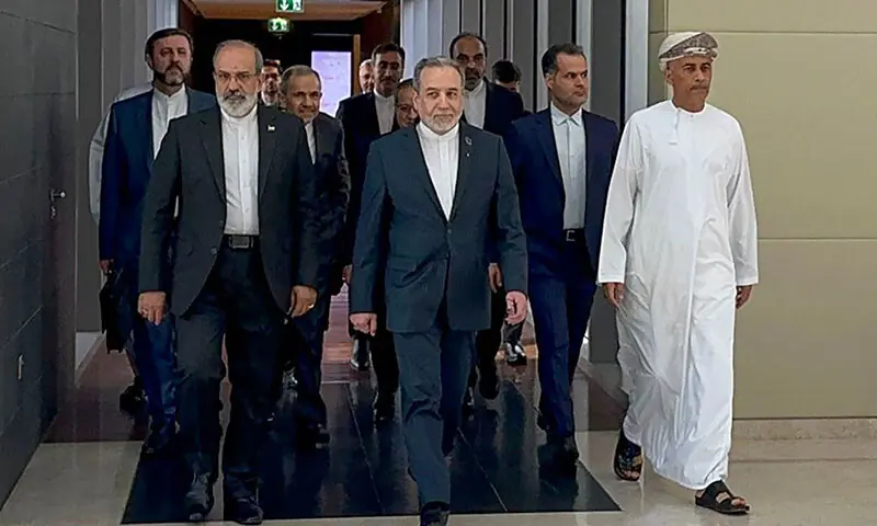 In this handout photo obtained from Iran&rsquo;s foreign ministry delegation on February 6, Iran&rsquo;s Foreign Minister Abbas Araghchi (C) arrives for talks with the United states in Muscat, Oman. &mdash; AFP