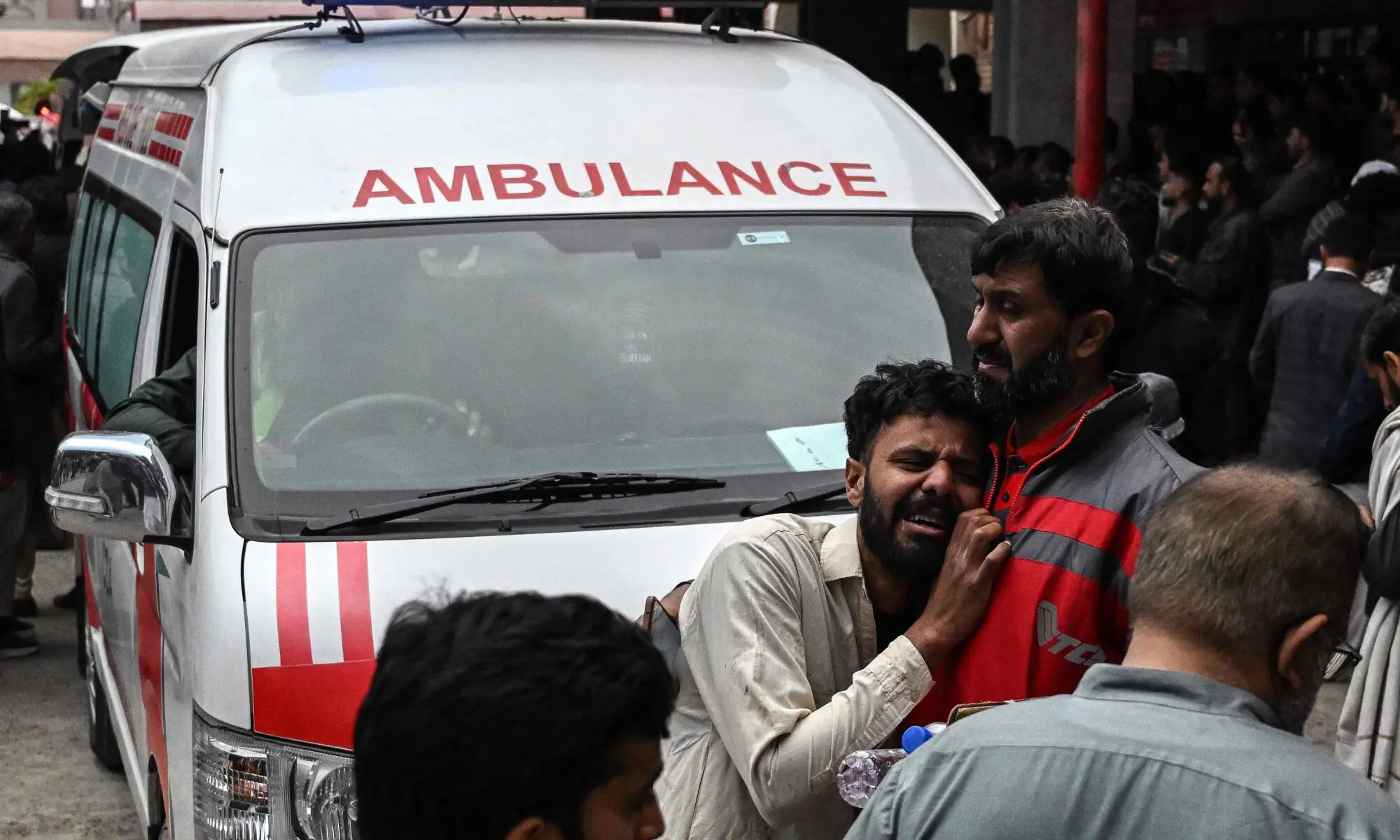 People mourn the death of their relatives following a suicide bombing at an imambargahm outside a hospital in Islamabad on February 6, 2026. &mdash; AFP