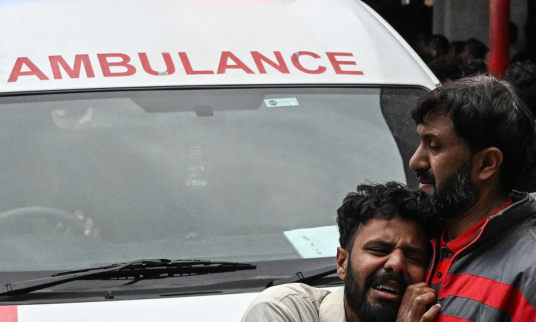 People mourn the death of their relatives outside a hospital in Islamabad on February 6,after a  suicide bombing at the Khadijah-tul-Kubra imambargah. &mdash; AFP