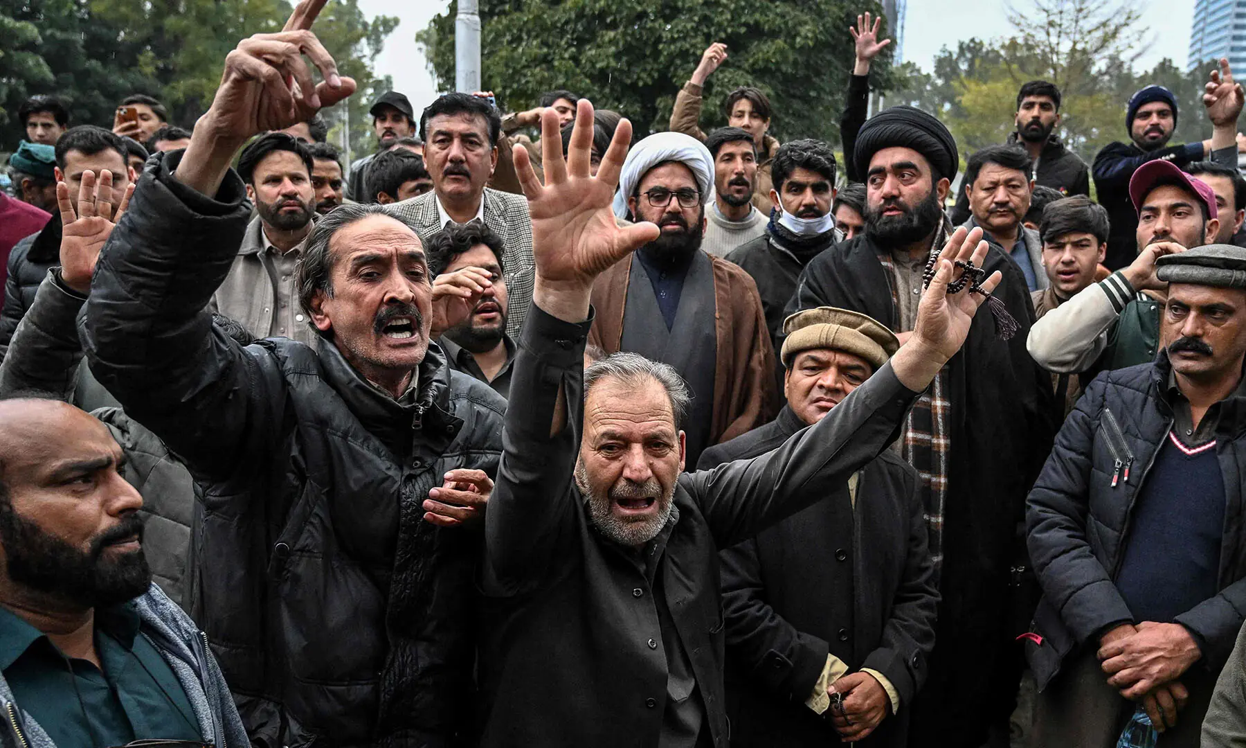 People chant slogans outside a hospital following a suicide bombing at the Khadijah-tul-Kubra imambargah in Islamabad on February 6. &mdash; AFP