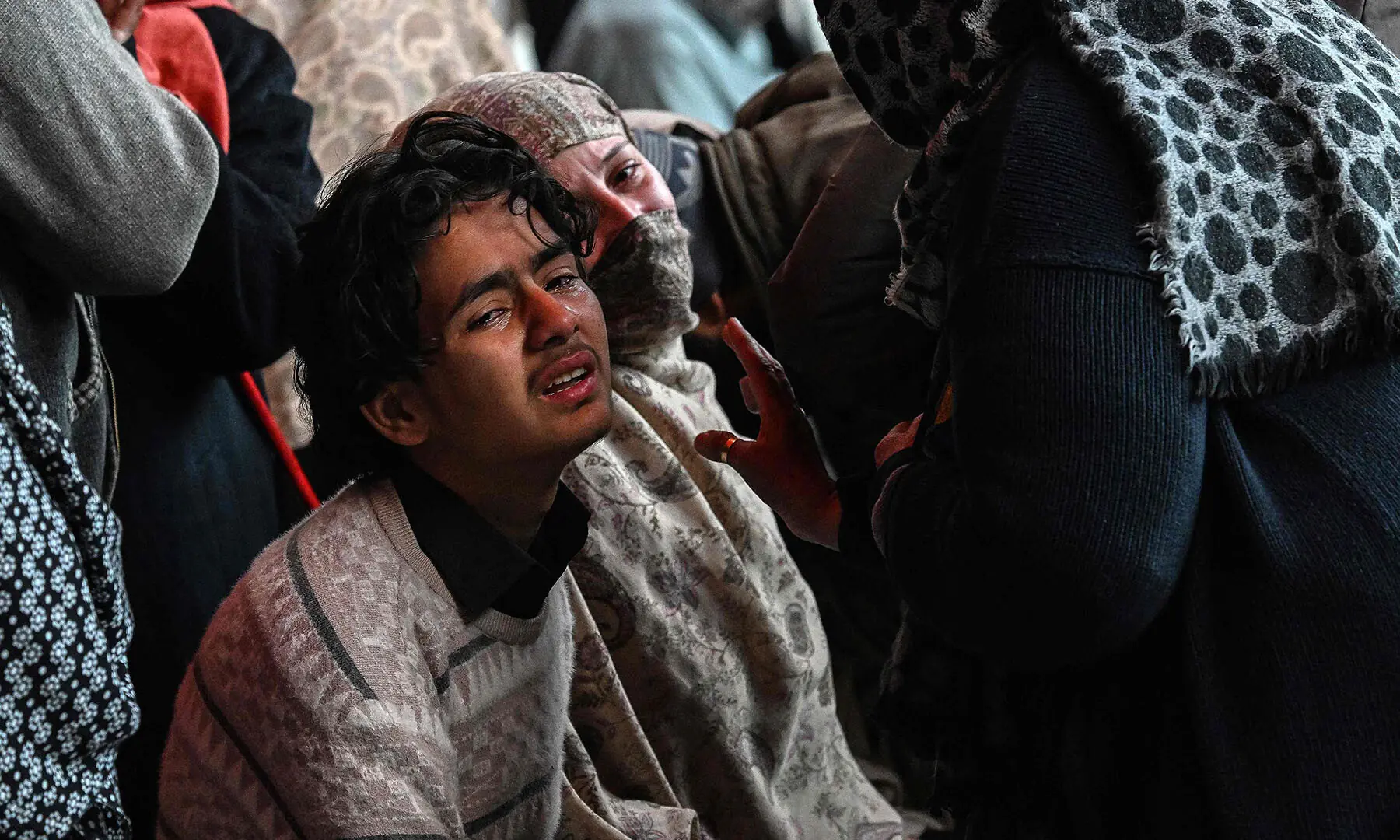 People mourn the death of their relatives following a suicide bombing at a Shiite mosque, outside a hospital in Islamabad on February 6, 2026. A suicide bombing at a Shiite mosque in Pakistan&rsquo;s capital Islamabad killed at least 31 people on February 6, local authorities said, with a police source saying more than 130 were wounded. (Photo by Aamir QURESHI / AFP)