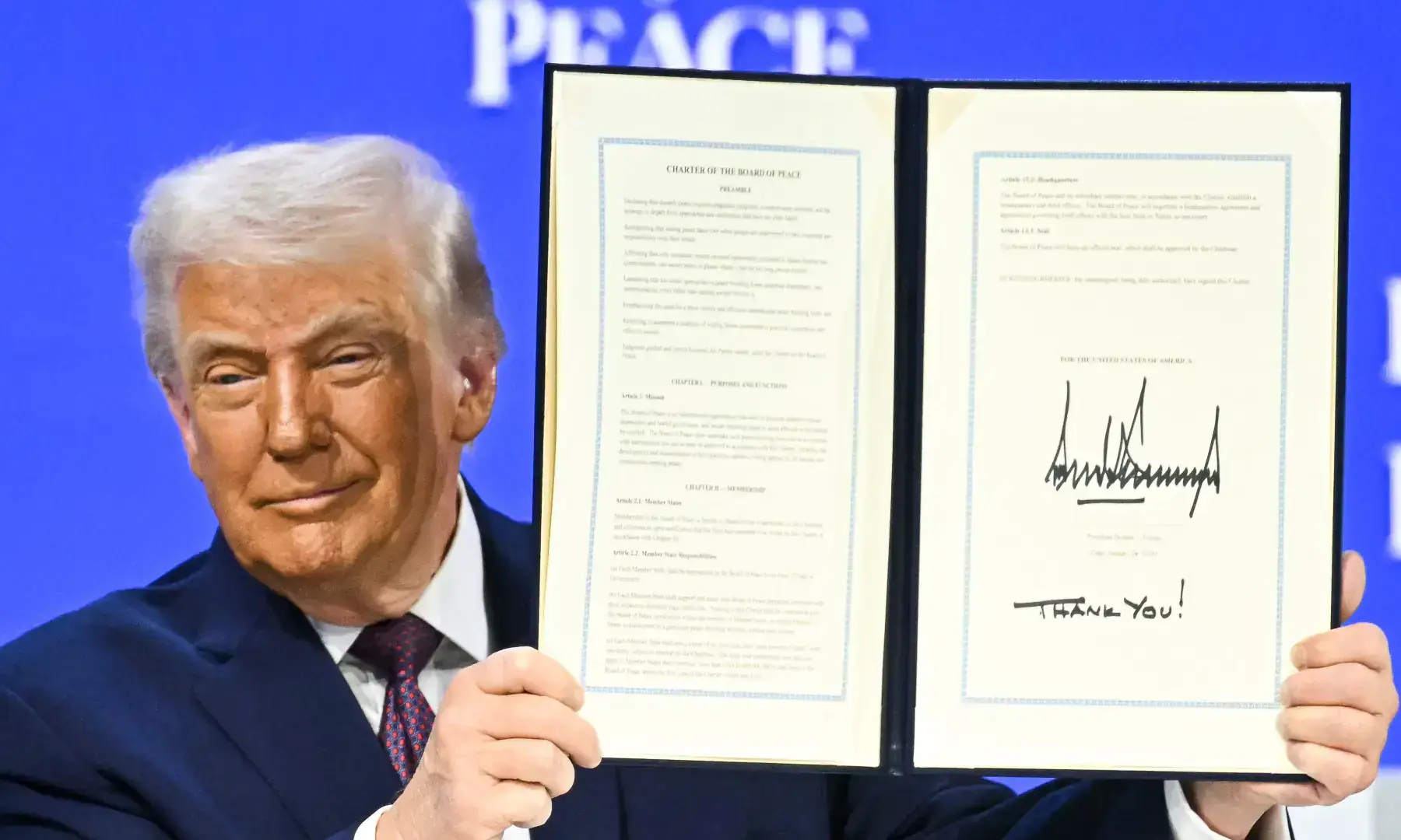 US President Donald Trump holds a signed founding charter at the “Board of Peace” meeting during the World Economic Forum (WEF) annual summit in Davos on Jan 22, 2026. — AFP/File US President Donald Trump holds a signed founding charter at the “Board of Peace” meeting during the World Economic Forum (WEF) annual summit in Davos on Jan 22, 2026. — AFP/File