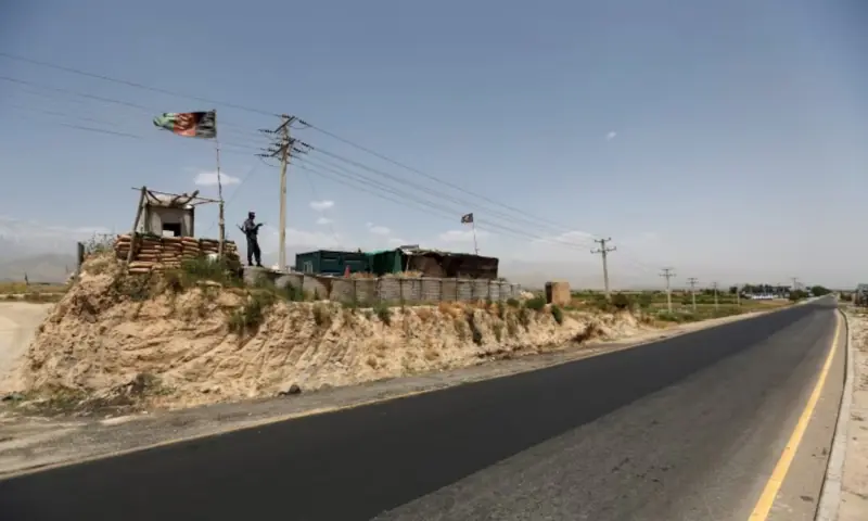 An Afghan policeman keeps watch at a check post on a highway, north of Kabul, Afghanistan on June 11, 2016. &mdash; Reuters/File