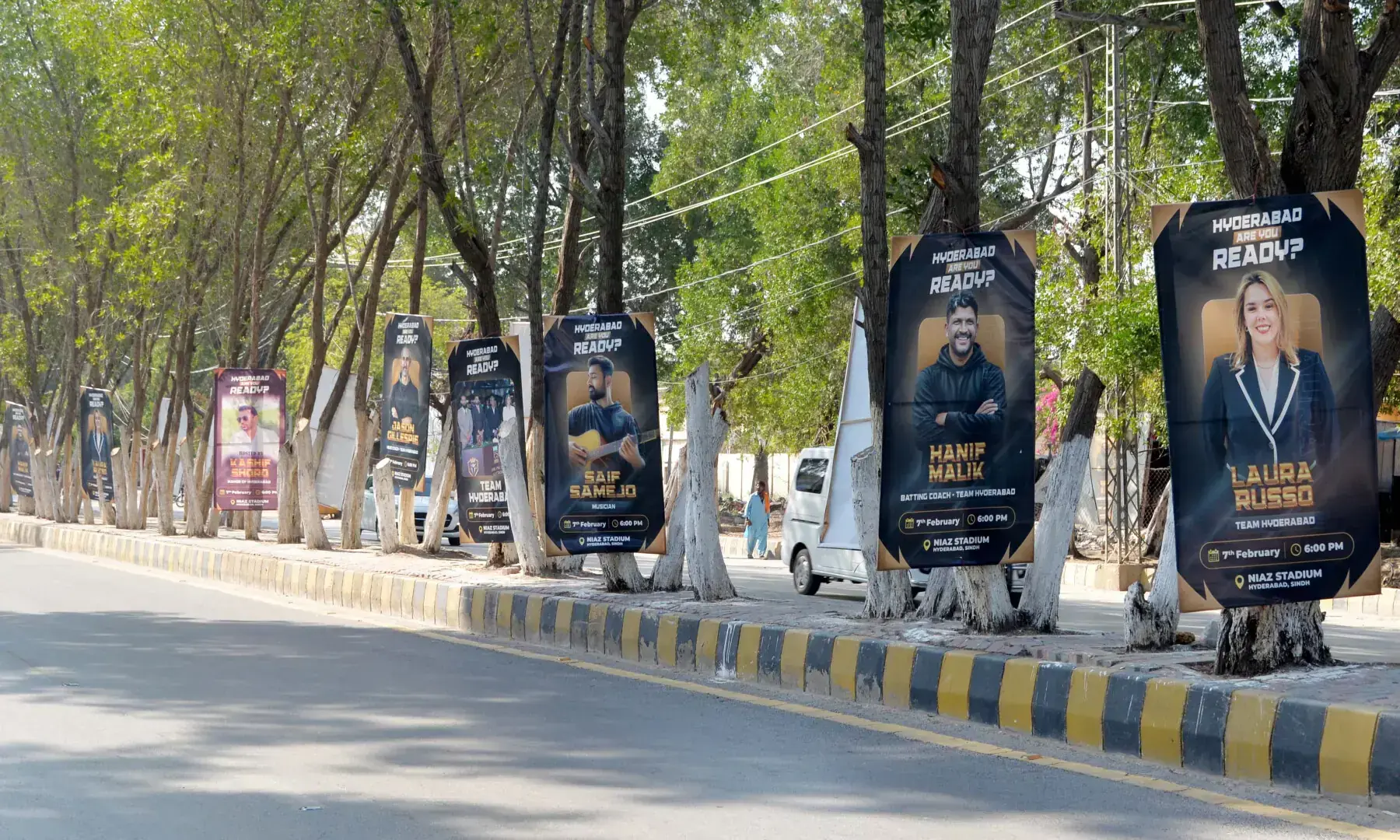 Posters for Saturday’s PSL Hyderabad team event hang on the trees that line Thandi Sarak. — Umair Ali Rajput Posters for Saturday’s PSL Hyderabad team event hang on the trees that line Thandi Sarak. — Umair Ali Rajput