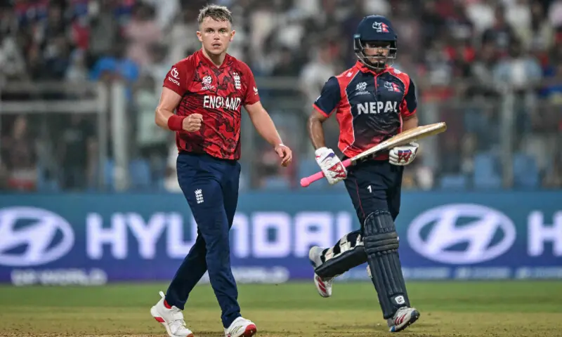 England&rsquo;s Sam Curran (L) reacts after his team&rsquo;s win as Nepal&rsquo;s Lokesh Bam looks on at the end of the 2026 ICC Men&rsquo;s T20 Cricket World Cup group stage match between England and Nepal at the Wankhede Stadium in Mumbai on February 8, 2026. &mdash; AFP