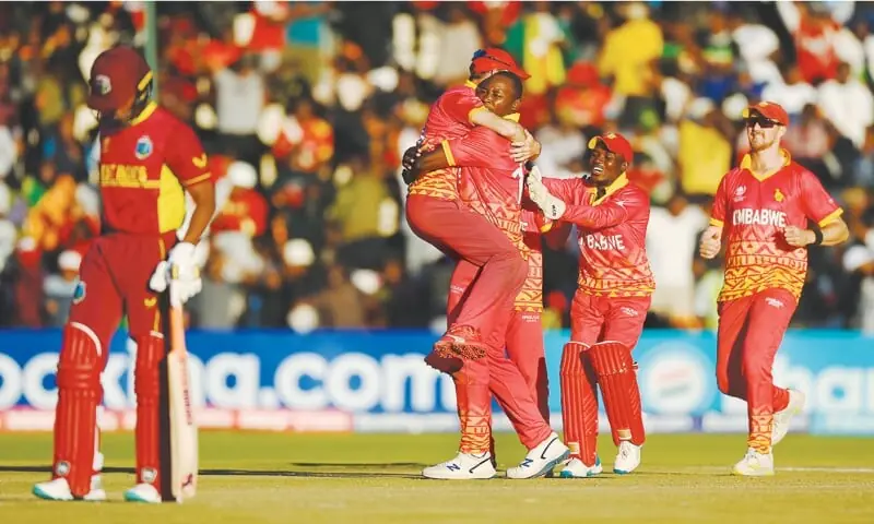 ZIMBABWE cricketers celebrate the dismissal of a West Indies batter during their World Cup qualifying match at the Harare Sports Club.&mdash;courtesy ICC