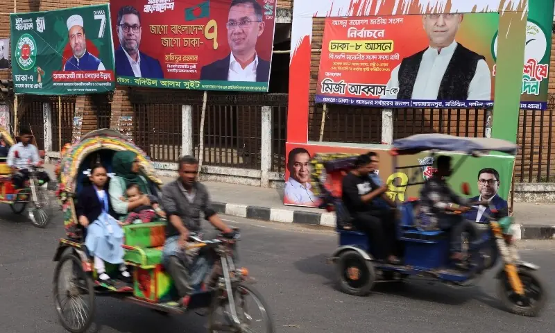 Vehicles pass by election campaign banners ahead of the national election, in Dhaka, Bangladesh, February 10, 2026. &mdash;Reuters