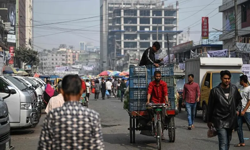 A man transports carts of vegetables at a marketplace ahead of Bangladesh&rsquo;s general election in Dhaka on February 10, 2026. &mdash;Reuters