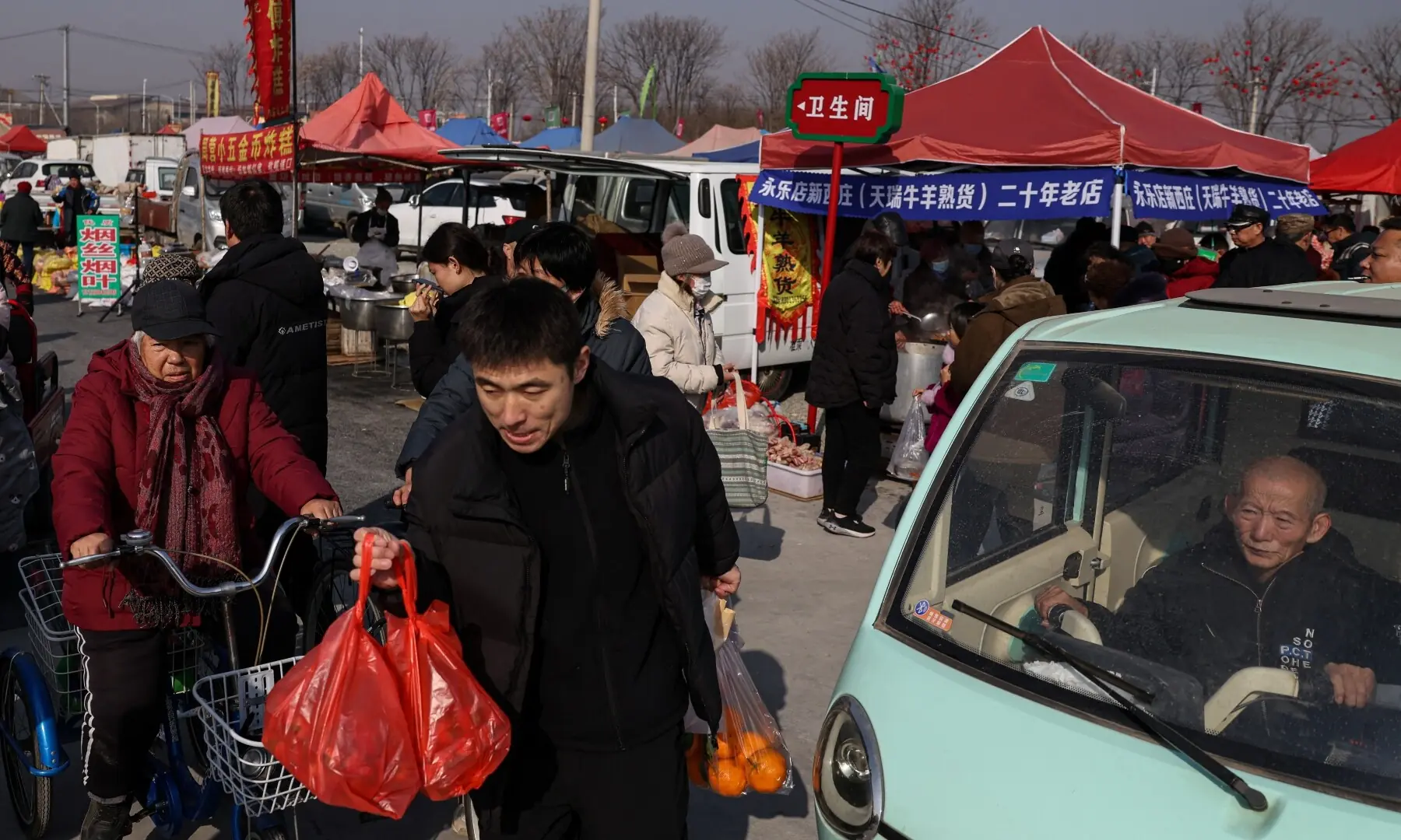 People visit an outdoor market ahead of the Lunar New Year, in Beijing, China February 10, 2026. —Reuters