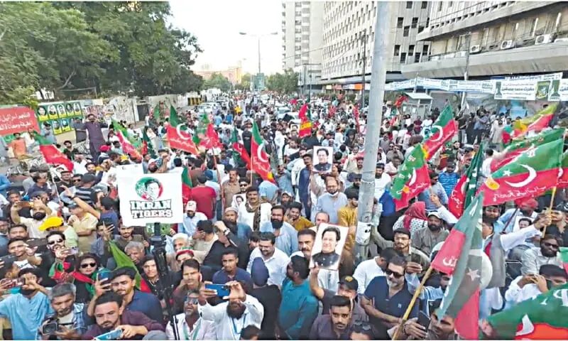 A large number of workers gather outside the Karachi Press Club for the rally, on Sunday.—Dawn A large number of workers gather outside the Karachi Press Club for the rally, on Sunday.—Dawn