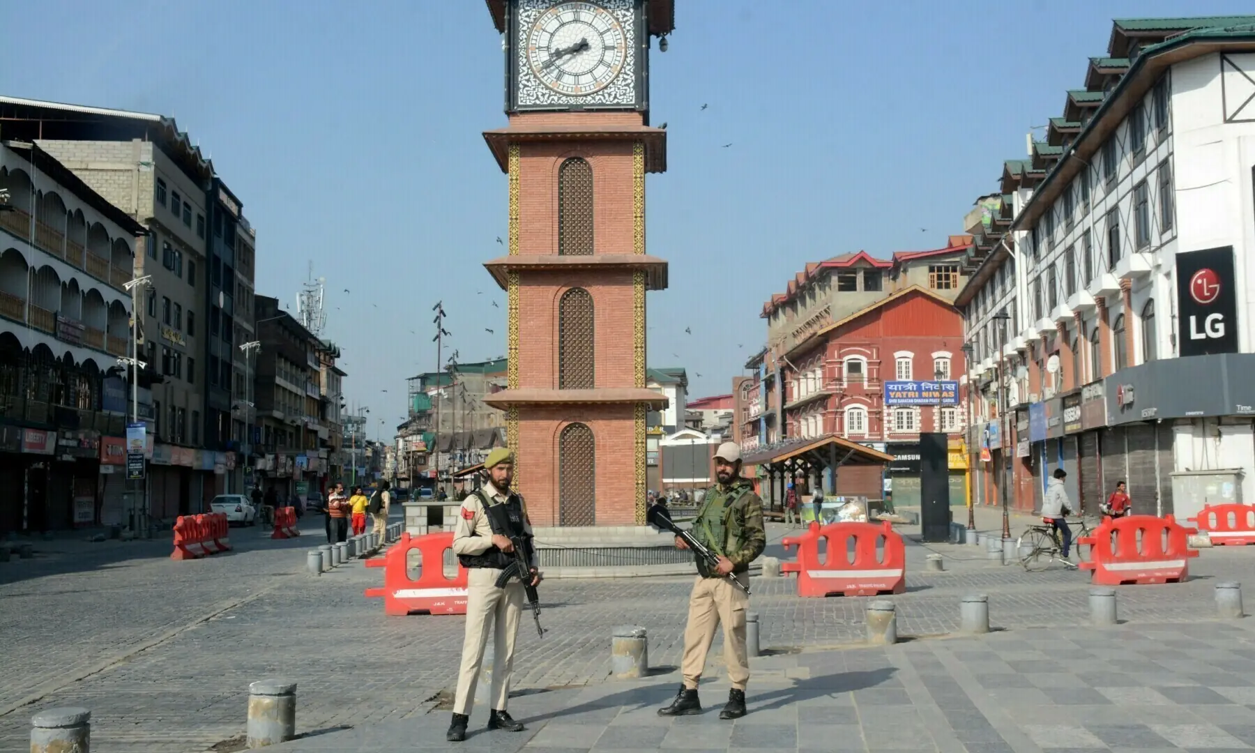 Indian police officers stand guard in front of clock tower following an attack near Pahalgam, at Lal Chowk area in Srinagar on April 23, 2025. &mdash; Reuters/File