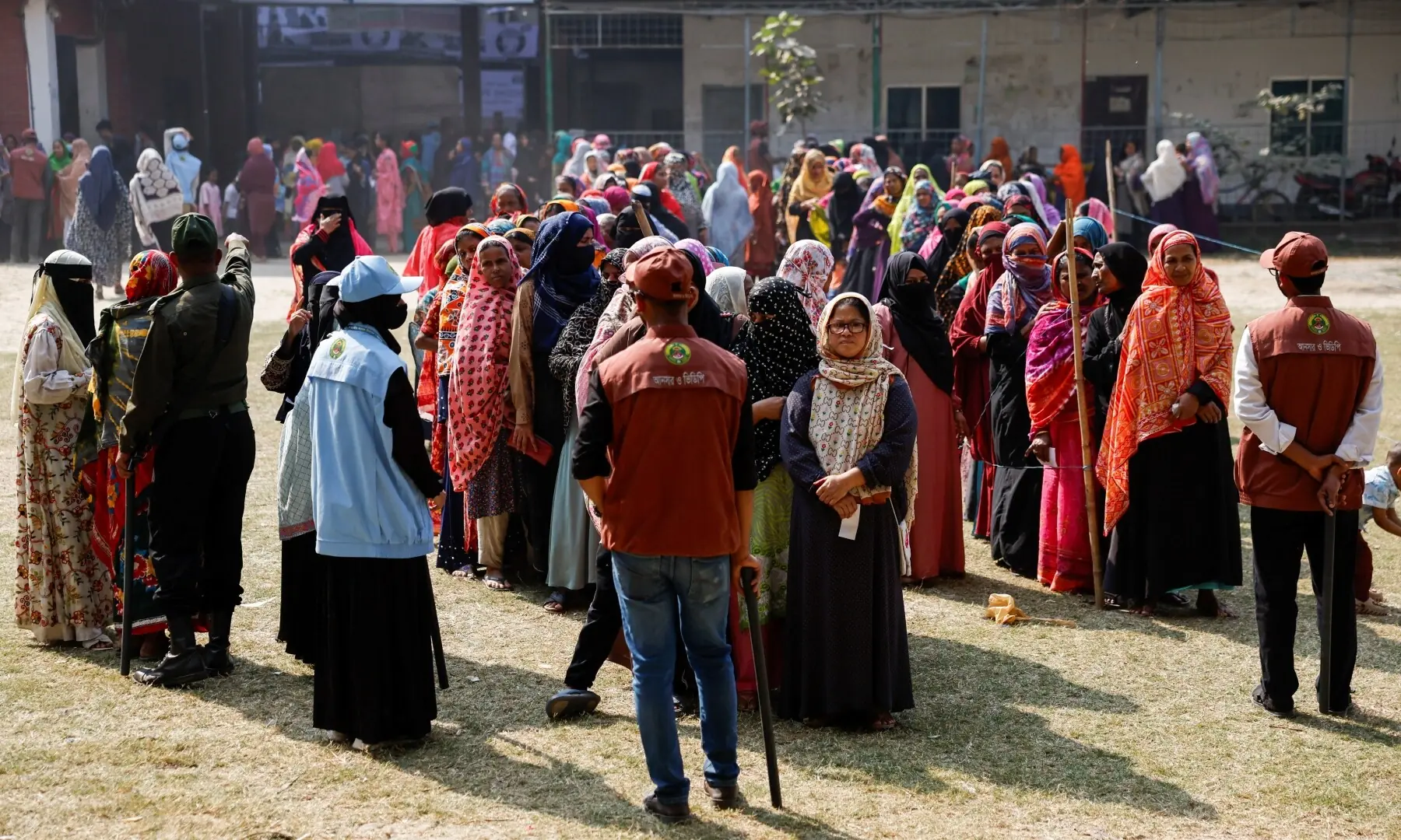 Voters stand in the queue to cast their vote at a polling station during the 13th general election in Dhaka, Bangladesh, February 12, 2026. &mdash;Reuters