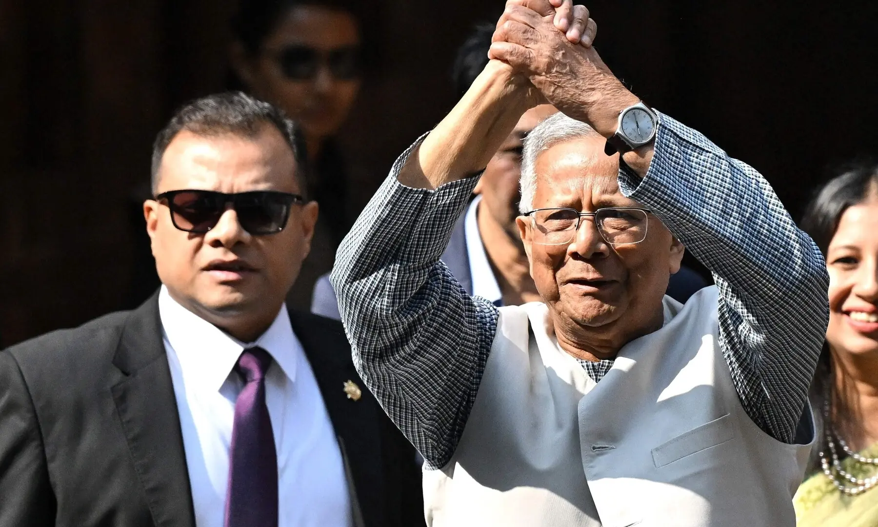 Chief Adviser of Bangladesh&rsquo;s Interim Government, Muhammad Yunus (R) gestures as he arrives to cast his ballot at a polling station during Bangladesh&rsquo;s general election in Dhaka on February 12, 2026. &mdash;AFP