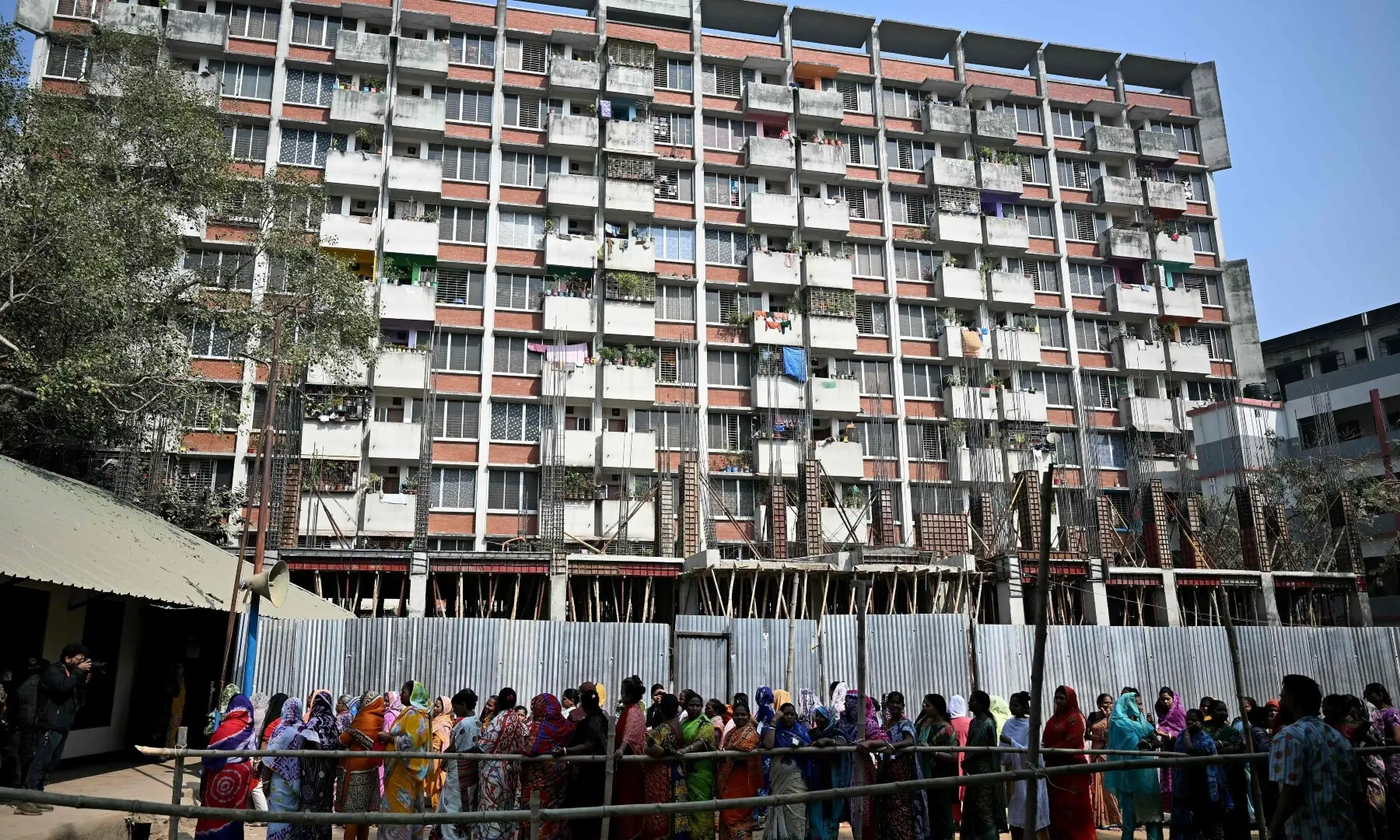 Bangladeshi women wait to cast their ballot at a polling station during Bangladesh&rsquo;s general election in Dhaka on February 12, 2026. &mdash;AFP