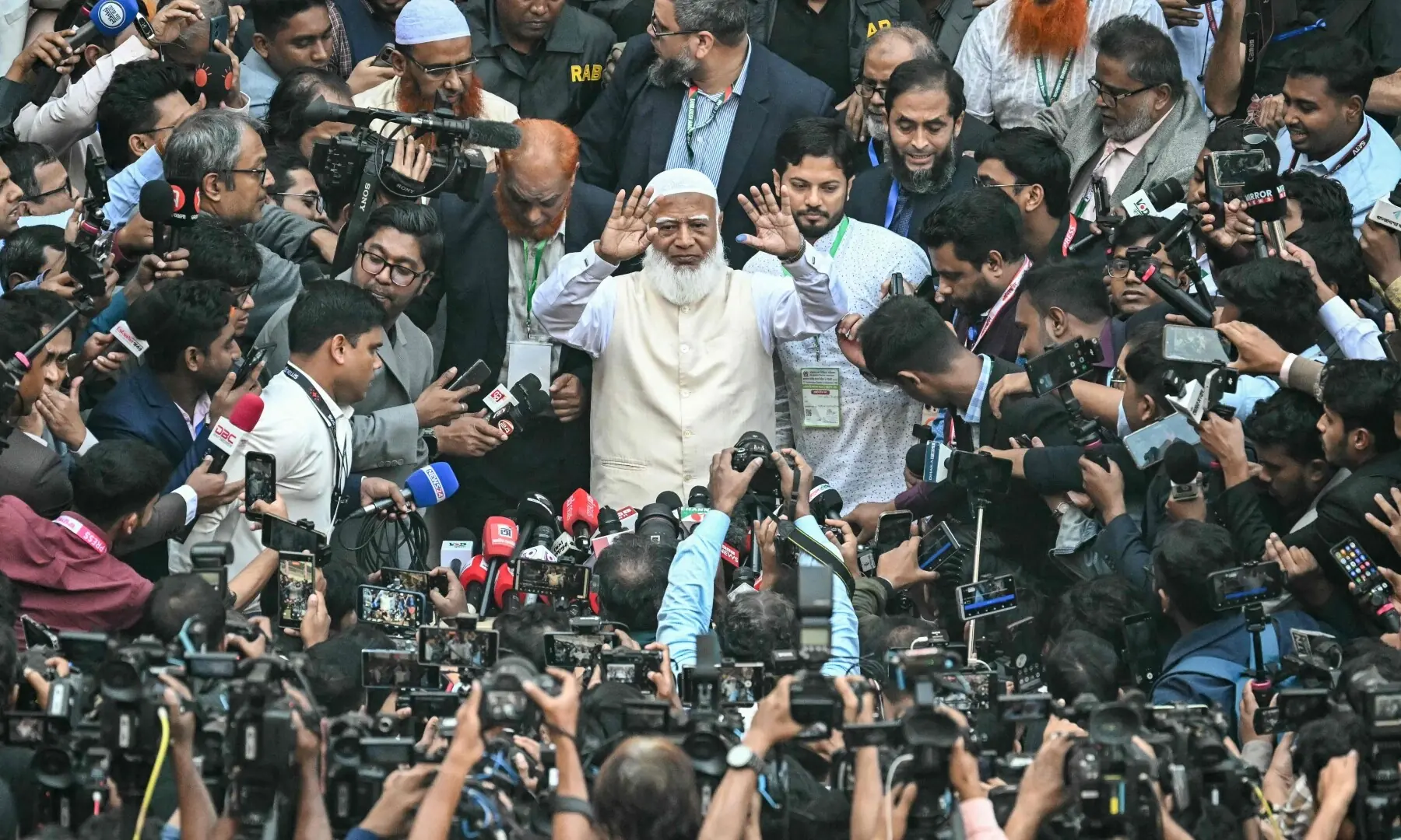 Bangladesh Jamaat-e-Islami party leader Shafiqur Rahman (C) gestures to the media after casting his vote at a polling station during Bangladesh&rsquo;s general election in Dhaka on February 12, 2026. &mdash;AFP