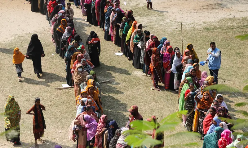 Voters stand in queues to cast their vote at a polling station during the 13th general election in Dhaka, Bangladesh on February 12, 2026. &mdash; Reuters