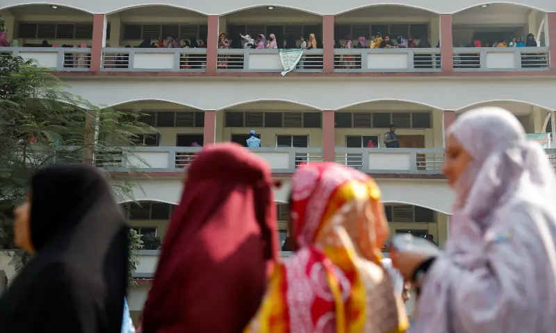 Voters stand in the queue to cast their vote at a polling station during the 13th general election in Dhaka, Bangladesh on February 12, 2026. &mdash; Reuters
