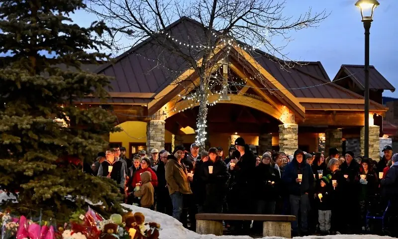 People attend a vigil the day after a deadly mass shooting took place, in the town of Tumbler Ridge, British Columbia, Canada February 11, 2026. &mdash;Reuters