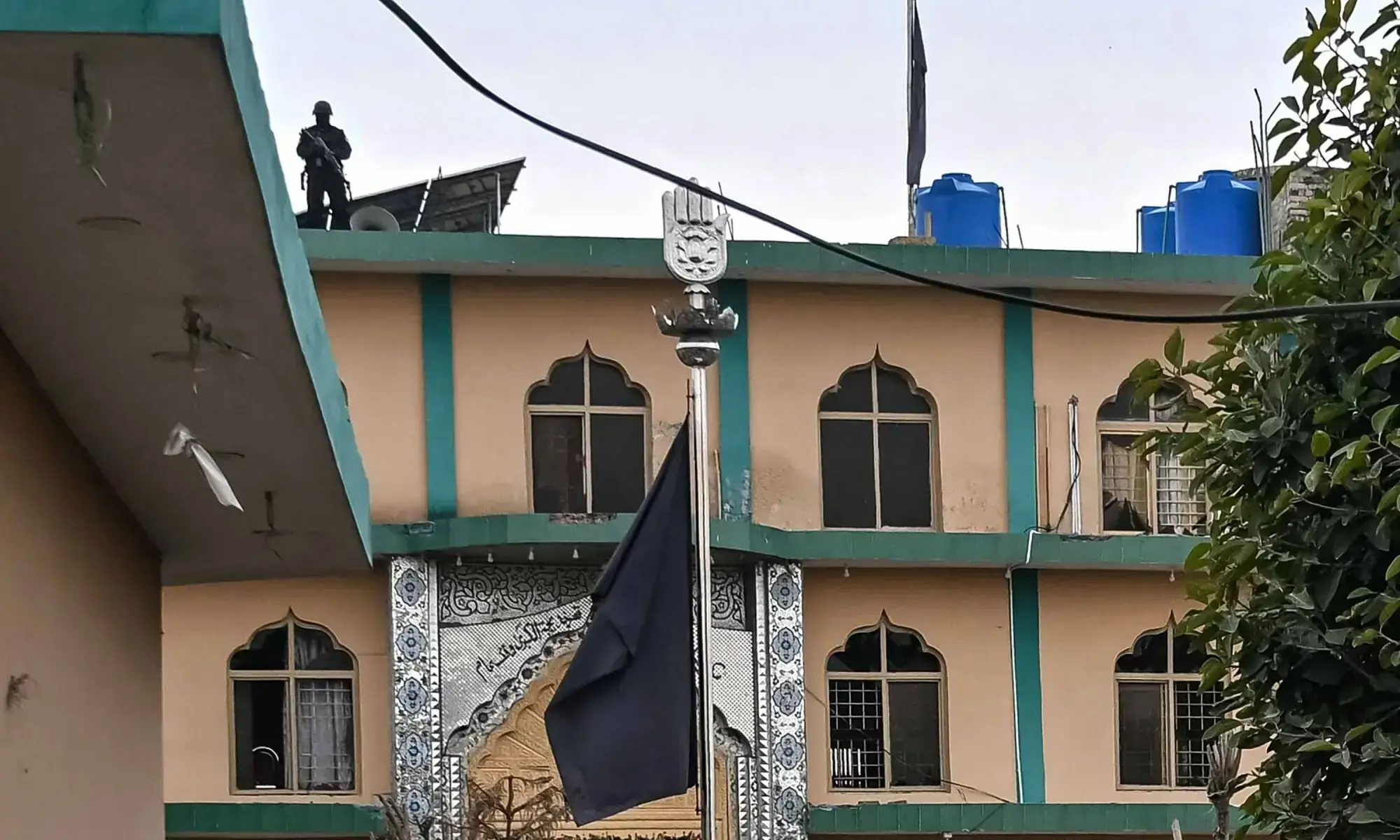 A security personnel stands guard at an imambargah following an explosion, in Islamabad on February 6, 2026. &mdash; AFP