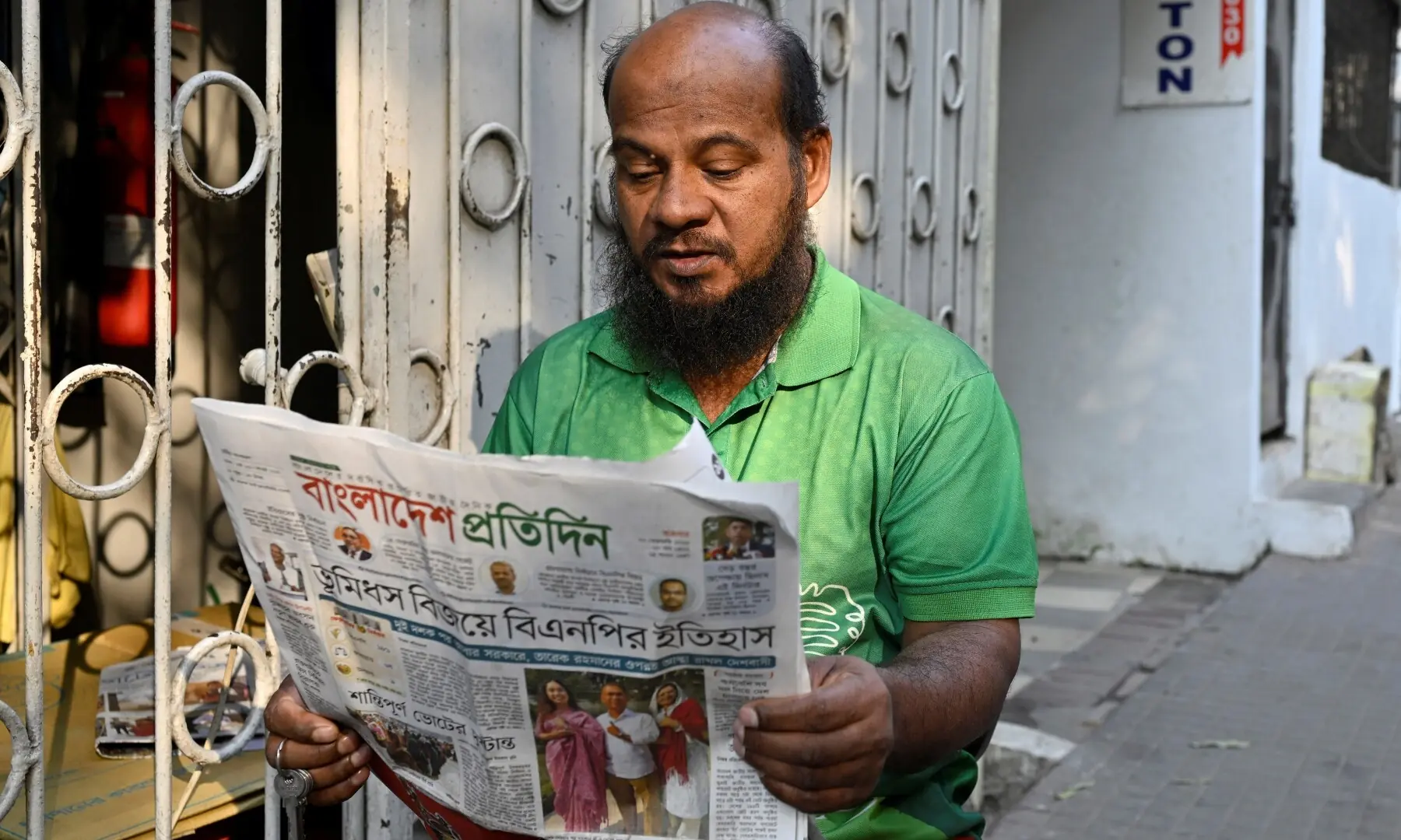 A man reads a newspaper with an election related headline, a day after the national election in Dhaka, Bangladesh, February 13, 2026. &mdash;Reuters