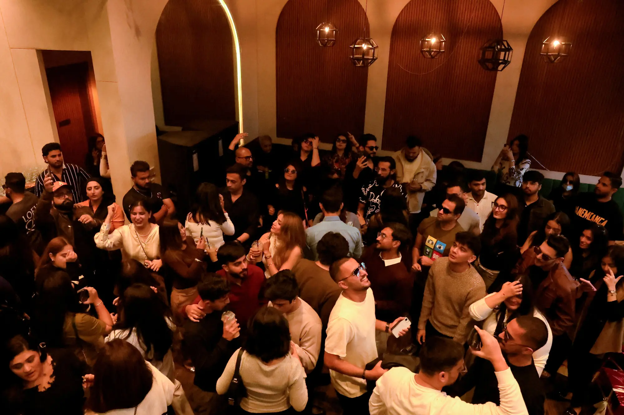 Participants dance to music during an event by 12xperience, at Cafe Ammos. Photo: Reuters
