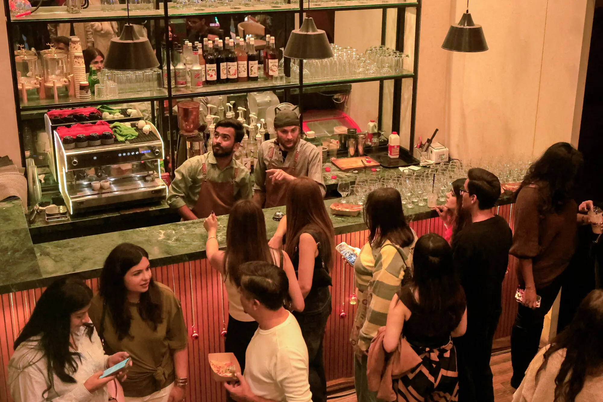 Participants attend an event by 12xperience, at Cafe Ammos. Photo: Reuters