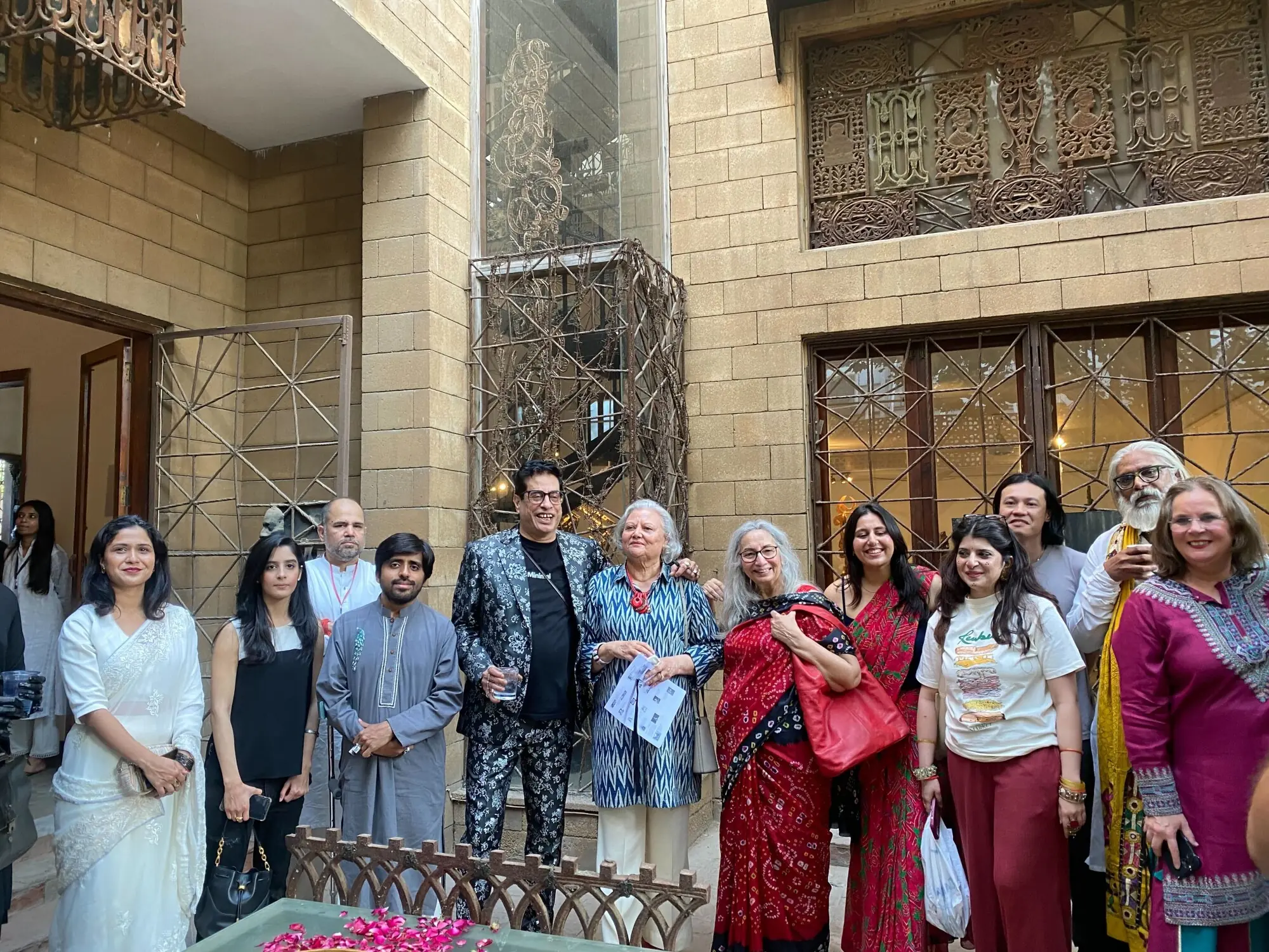  Amin Guljee poses with some of the artists for Karachi Biennale&rsquo;s curtain raiser. Photo:Author 