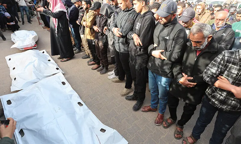Mourners pray during the funeral of Palestinians killed in an overnight Israeli strike at Nasser Hospital in Khan Younis in the southern Gaza Strip on Feb 15, 2026. — Reuters Mourners pray during the funeral of Palestinians killed in an overnight Israeli strike at Nasser Hospital in Khan Younis in the southern Gaza Strip on Feb 15, 2026. — Reuters