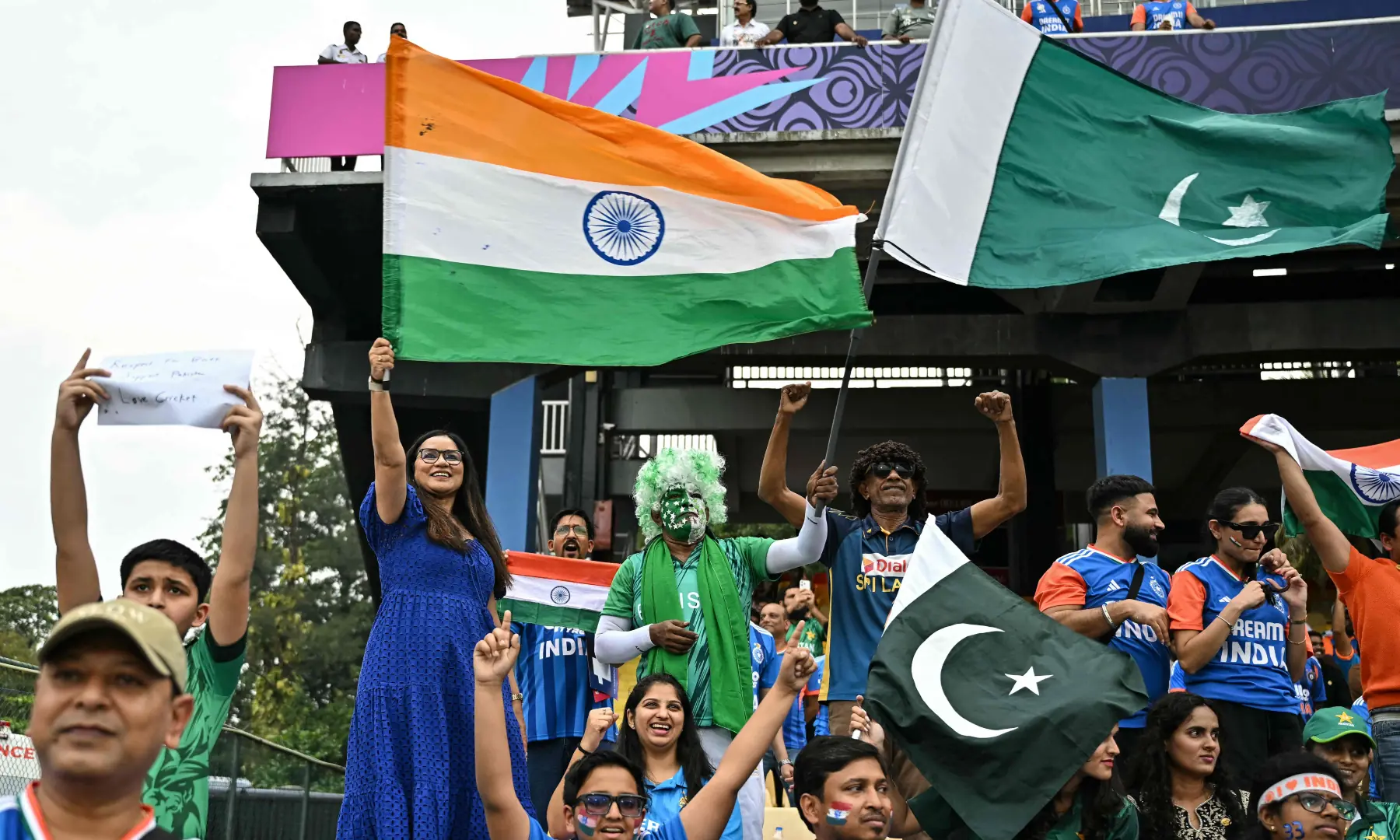 Fans wave national flags of India and Pakistan from the stands before the start of their 2026 ICC Men&rsquo;s T20 Cricket World Cup group stage match at the R Premadasa Stadium in Colombo on Feb 15, 2026. &mdash; AFP
