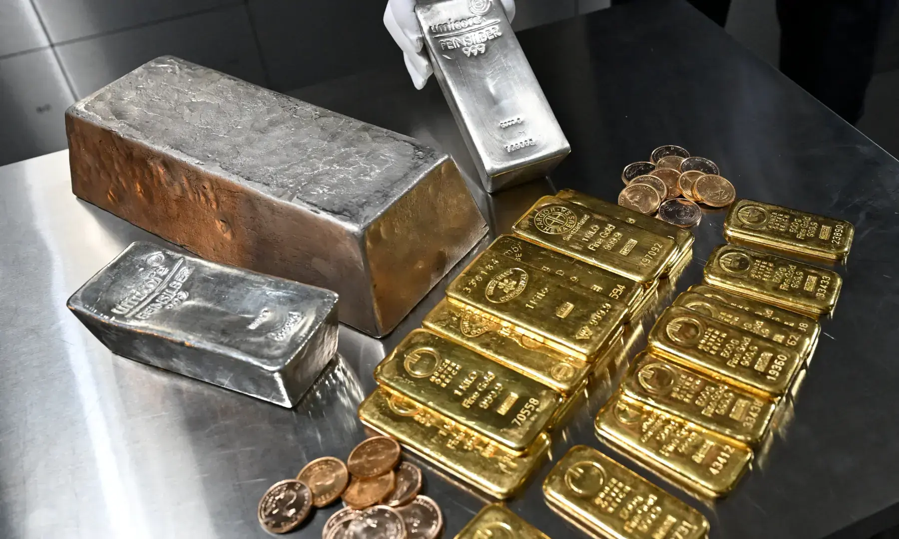 An employee shows a silver bar, as&nbsp;gold&nbsp;and silver bars of various values in Munich, Germany, January 28, 2026 &mdash; Reuters/File