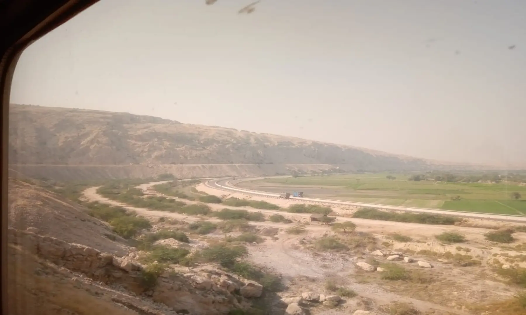 Picture of the landscape taken from a moving train. &mdash; Author