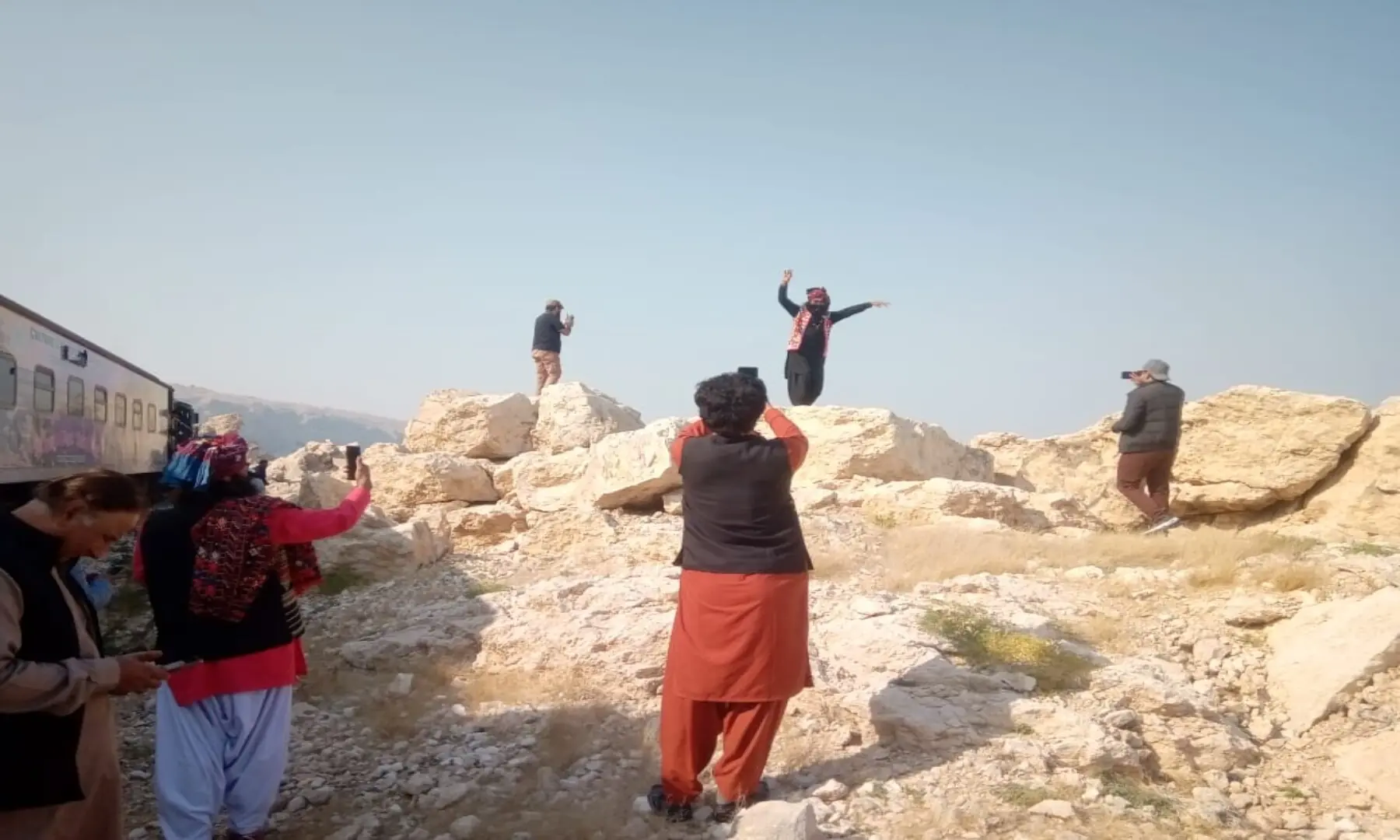 Host artists from the STDC performing a traditional Sindhi dance atop a mound. &mdash; Author