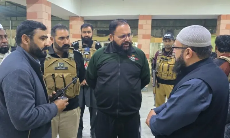 Police officials examine the scene following the attack in Dera Ismail Khan on Feb 18. —Photo via author Police officials examine the scene following the attack in Dera Ismail Khan on Feb 18. —Photo via author