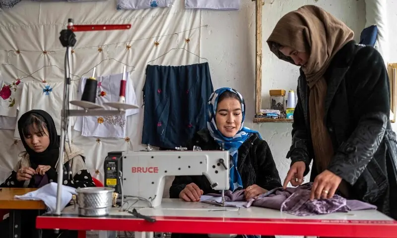 This photograph taken on January 20, 2026 shows Afghan women embroidering scarves and clothes at a boutique in Bamiyan. &mdash;AFP