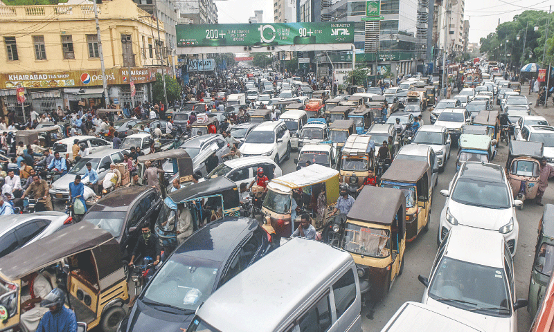 Motorists are stuck in the gridlock at the intersection of I.I. Chundrigar Road and Dr Ziauddin Ahmed Road, on Oct 7. &mdash;Fahim Siddiqi / White Star