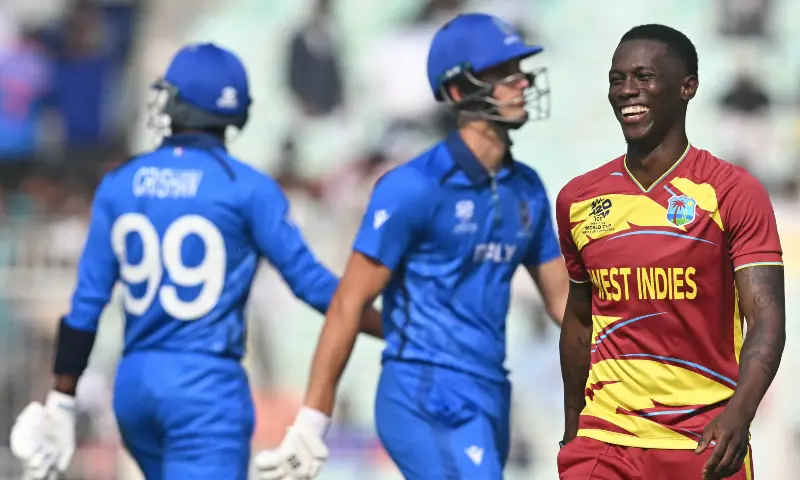 West Indies&rsquo; Shamar Joseph (R) celebrates after taking the wicket of Italy&rsquo;s Thomas Draca (C) during the 2026 ICC Men&rsquo;s T20 Cricket World Cup group stage match between West Indies and Italy at the Eden Gardens in Kolkata on February 19. &mdash; AFP